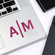 4 inch split initial glitter pink vinyl sticker on laptop corner