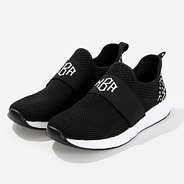 monogrammed slip on sneakers in black dottie