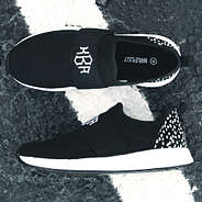 top and side views of monogrammed slip on sneakers
