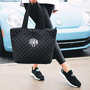 diamond quilted tote in hand with vw bug in back