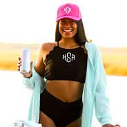 scalloped high neck bikini top with pink trucker hat.