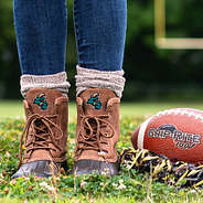 coastal carolina duck boots with brown socks on football field