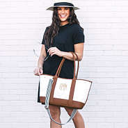 monogrammed purse expanded and on model's arm