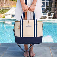 navy blue canvas cooler at pool with name embroidered