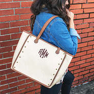 monogrammed vintage canvas tote on shoulder