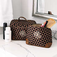 black/brown vintage cosmetic case with vintage train case