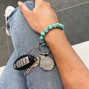 Mint Marble Key Ring on girls arm