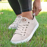 slipping comfy knit sneakers on