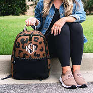 Hickory backpack leopard beside sneakers