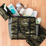 camo diaper bag spilled out with name