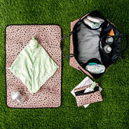 monogrammed neoprene diaper bag in blush safari on grass