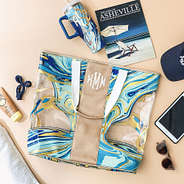 navy blue massive beach bag with monogrammed tumbler and beach accessories