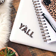 y'all leopard sticker on laptop