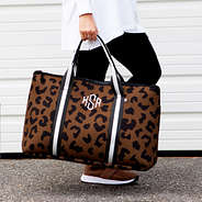 girl walking with carry on bag in hickory leopard