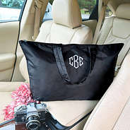 black packable duffel bag in car