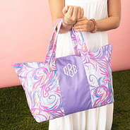 purple splish splash packable duffel bag on girls arm
