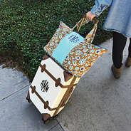 folk floral packable weekend duffel bag on vintage suitcase