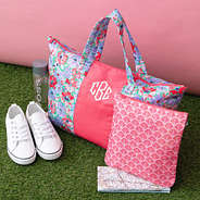 coral botanical packable weekend duffel on grass