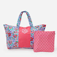 monogrammed packable duffel in coral botanical