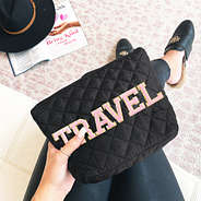 black diamond quilted case with small pink letters