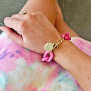 pink monogrammed acrylic link bracelet with tie dye dress