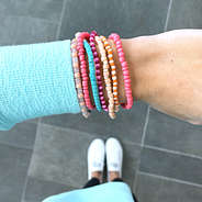 pink twisted bead bracelet on wrist- ootd