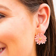 daisy earrings in ear
