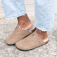 personalized clogs in tan on concrete