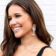 gold sparkle champagne earring on brunette