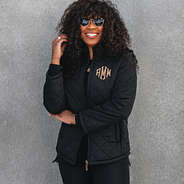 monogrammed black puffer quilted jacket with leggings and sunglasses