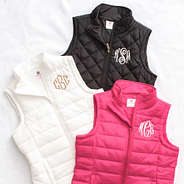 trio puffer vest in black, white, and pink