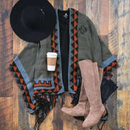 Monogrammed Aztec Poncho with tall riding boots