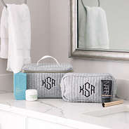gray quilted train case and cosmetic case
