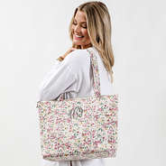 fall botanical quilted tote bag on shoulder