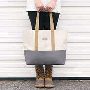 girl holding savannah tote with name