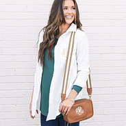 monogrammed camera crossbody in brown leather over shoulder