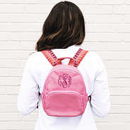 mini rose gold backpack being worn