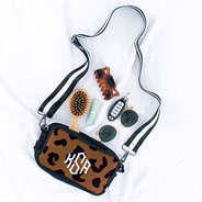 Monogrammed Neoprene Crossbody Camera Bag with contents spilled