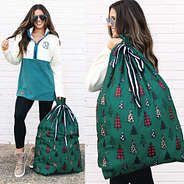 gift sack in festive forest over the shoulder