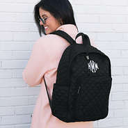 Black Quilted Laptop Backpack on shoulders