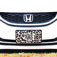 monogrammed cheetah print license plate on white honda