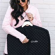 black diamond quilted garment bag up close with name monogram