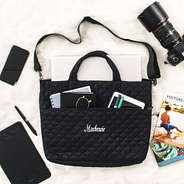 black quilted laptop bag flatlay name