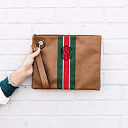 girl holding brown spencer wristlet