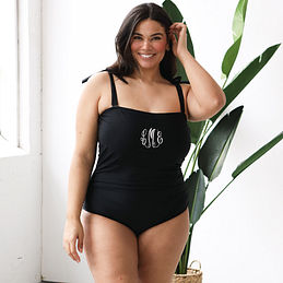 black monogrammed one piece bathing suit with white monogram