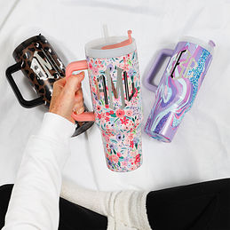 https://images.marleylilly.com/profiles/ml-product-list/product/109933/sQe-cheetah-purple-marble-coral-floral-in-hand-40oz-travel-tumblers-spead-out.jpg