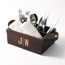 monogrammed wooden caddy with kitchen utensils and napkins