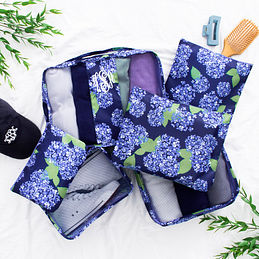 blue hydrangea packing bag set on bed