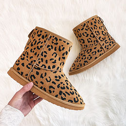 leopard boots on white rug