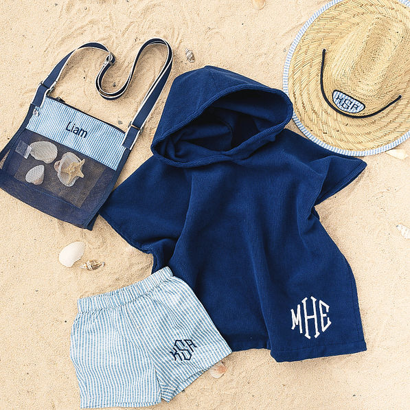 boy monogrammed seashell bag with straw hat swim trunks and poncho